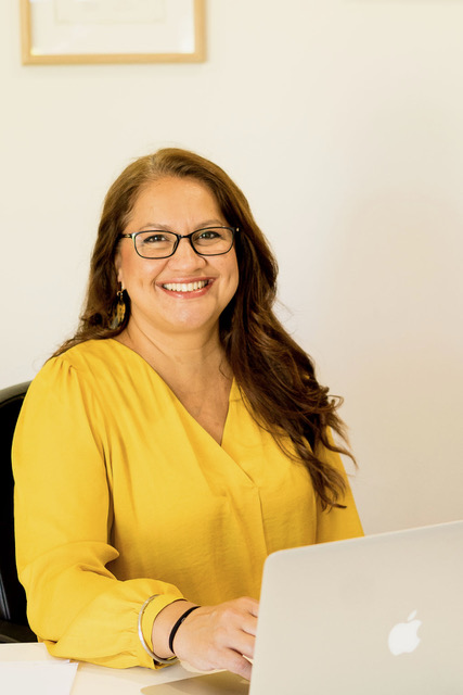 Sim smiling warmly, ready to welcome older clients